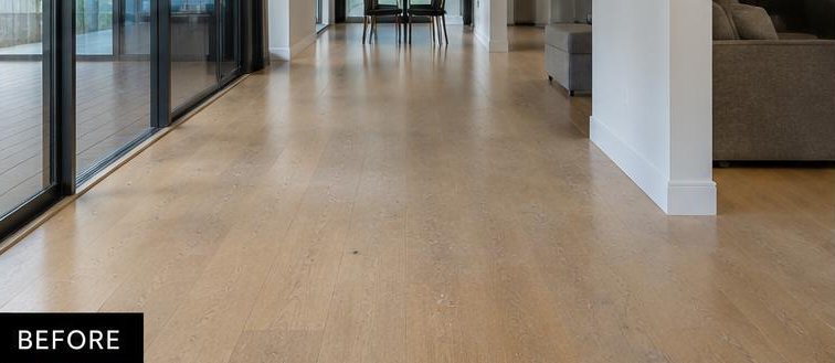Timber floor before cleaning — dull with marks and scuffing across the boards