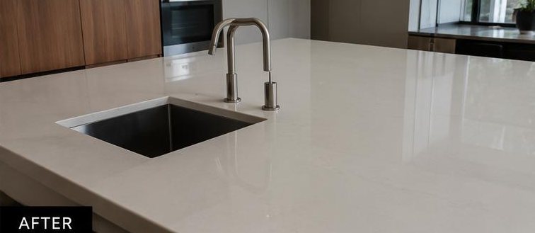 The same kitchen benchtop and sink after cleaning by Fresco — stone clear, bright and streak-free